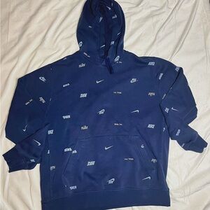 Nike Men's Navy Logo Hoodie has a slight tare by the pocket but not noticeable